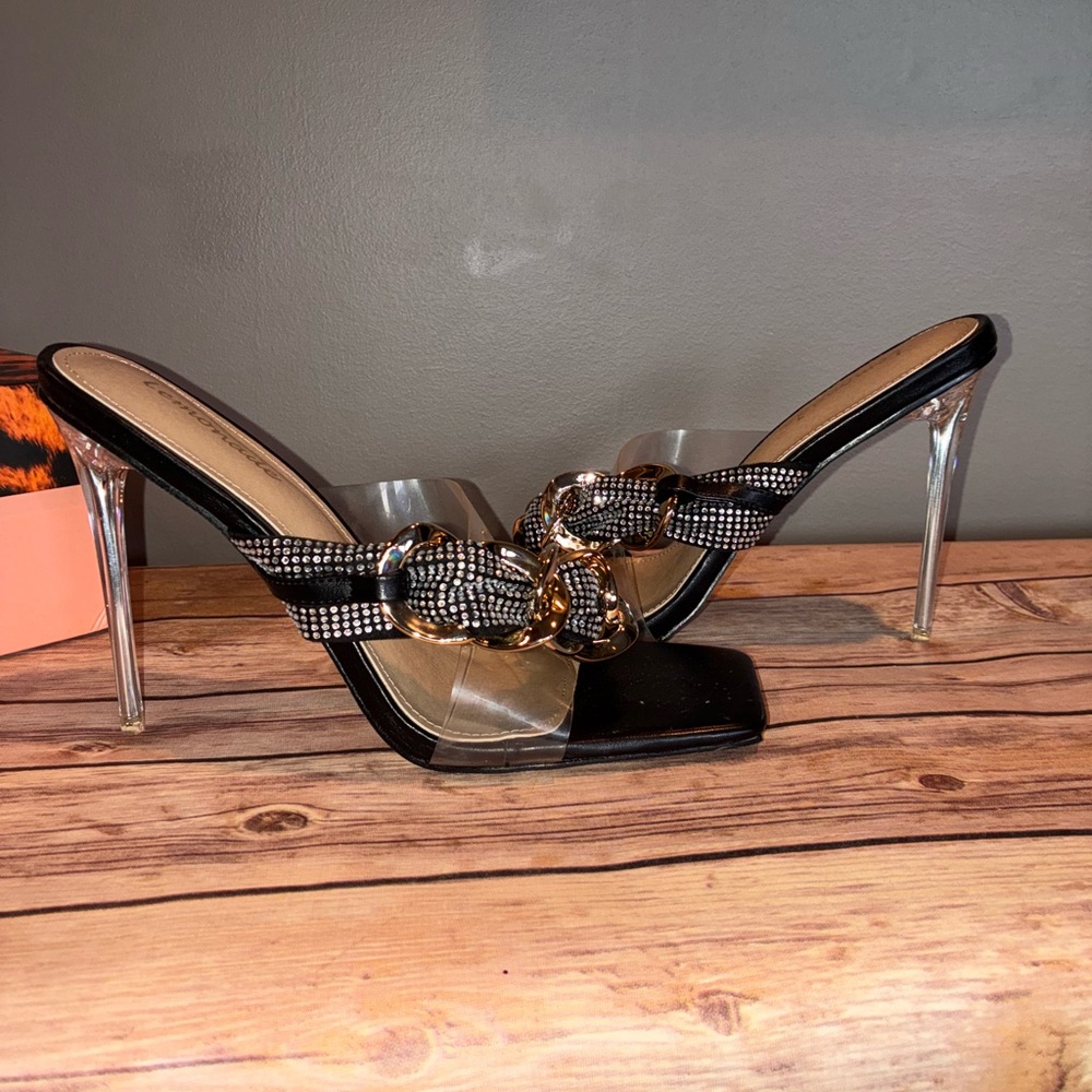 Elegant Black and Gold Women's Heels with clear strap